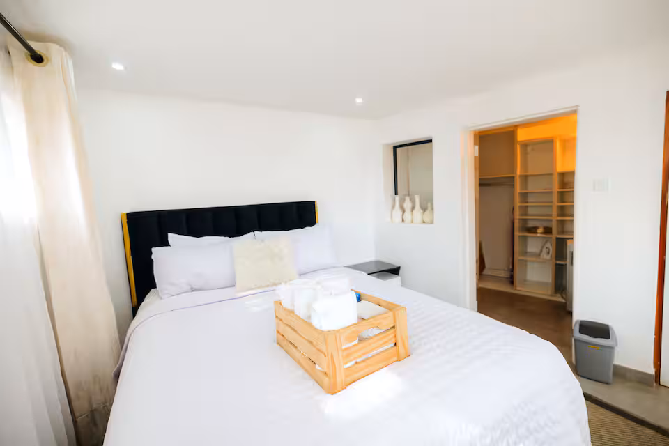 King-size bedroom with hotel-grade linen — The Nest, Hayhill Treetop Escape Harare